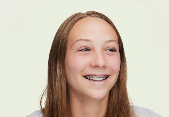 smiling teen wearing braces