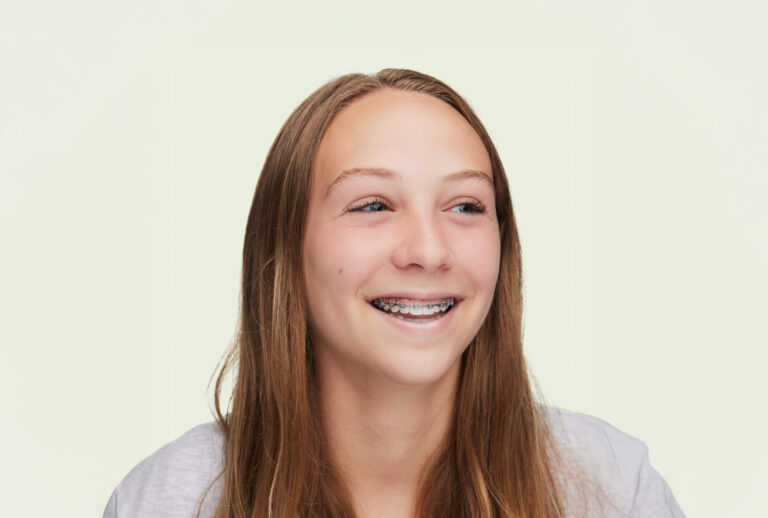 smiling teen wearing braces