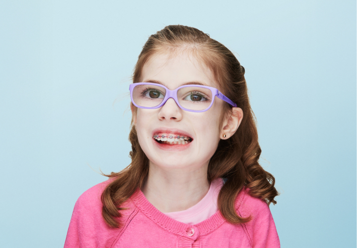 young girl wearing glasses and braces