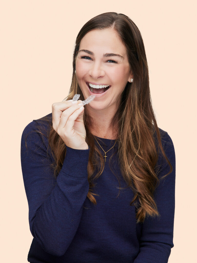 smiling woman with invisalign