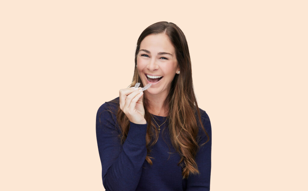 smiling woman with invisalign