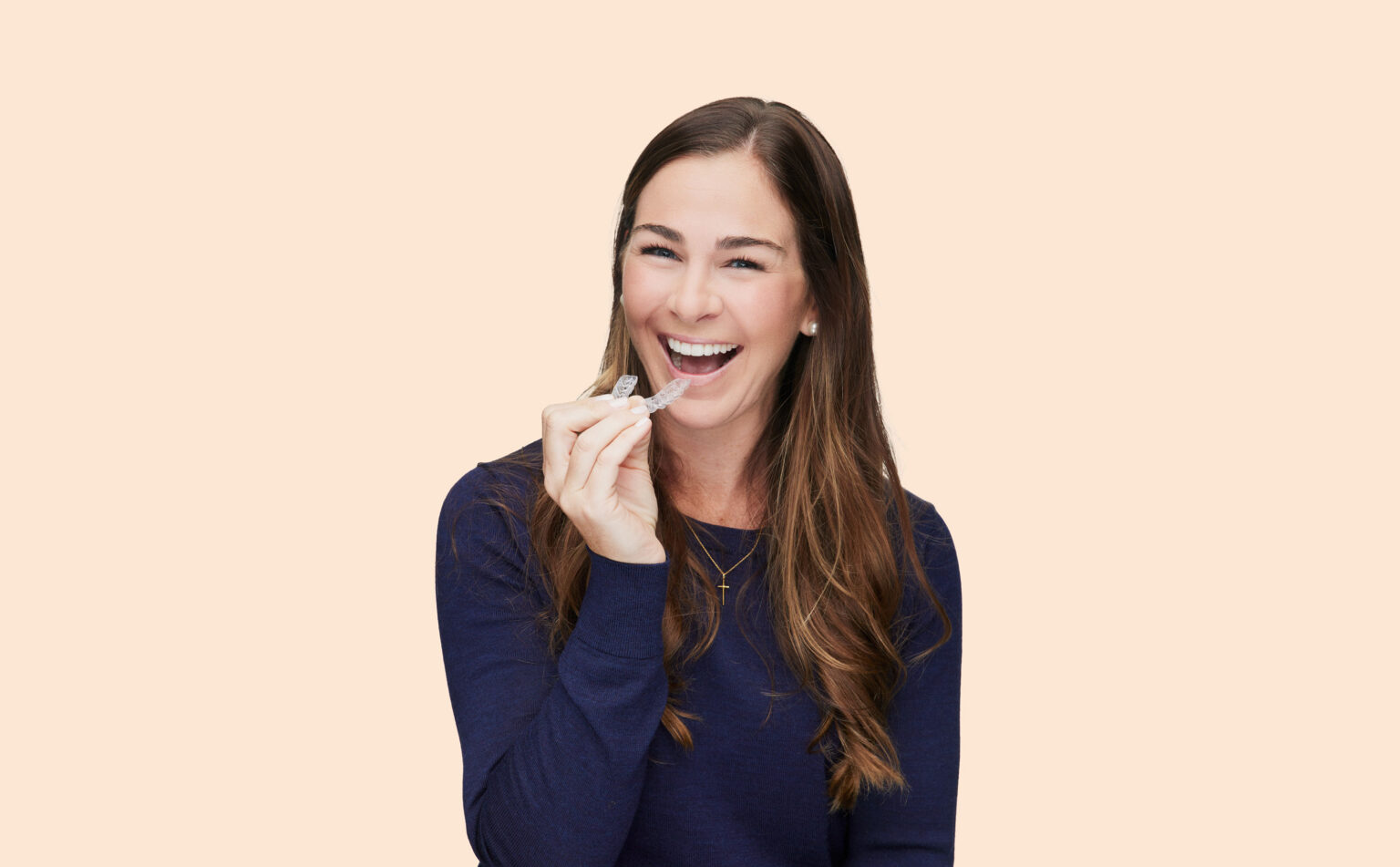 smiling woman with invisalign