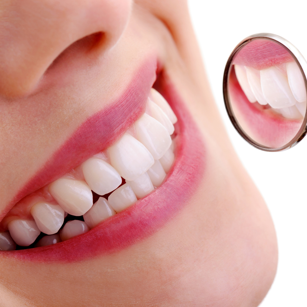 Close Up Of Smiling Woman Getting Teeth Examined